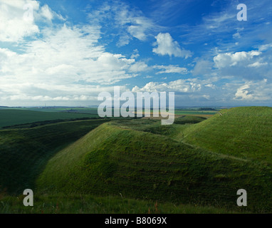 Ramparts and ditches at Maiden Castle, Dorchester, Dorset, UK. An Iron Age hill fort mainly built around 400 BC, it is the largest hill fort in Europe Stock Photo