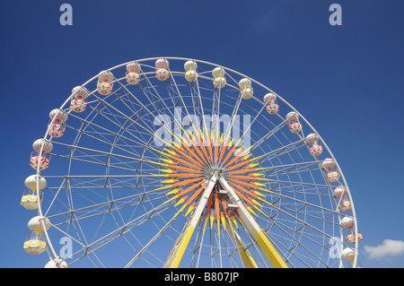 Ferris wheel against blue sky Stock Photo