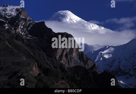 snowy peak in evening light Karakoram Range Northern Areas Pakistan Stock Photo