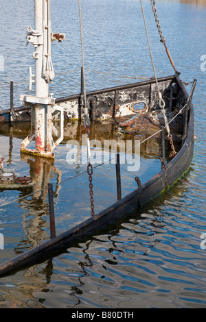 Sunken steel boat decoration in Lake Cherry in The Villages retirement community in Central Florida, USA Stock Photo