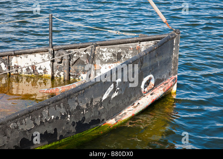 Sunken steel boat decoration in Lake Cherry in The Villages retirement community in Central Florida, USA Stock Photo