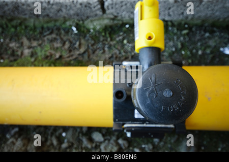 Junction of main gas pipe to tap off supply pipe. Stock Photo