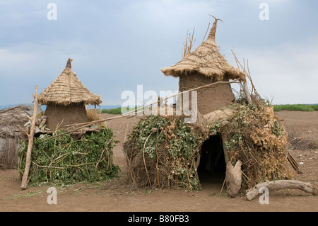 Little storage houses from the tribe of the Dasanech Omovalley Ethiopia Africa Stock Photo