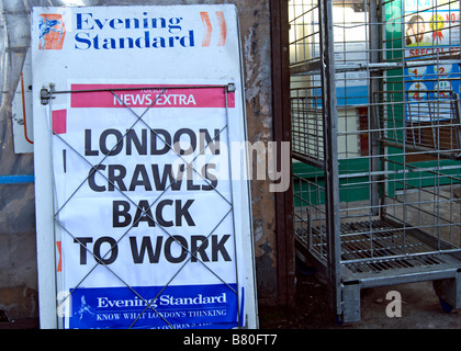 evening standard newspaper hoarding with headline london crawls back to work, following heavy snow in early february, 2009 Stock Photo