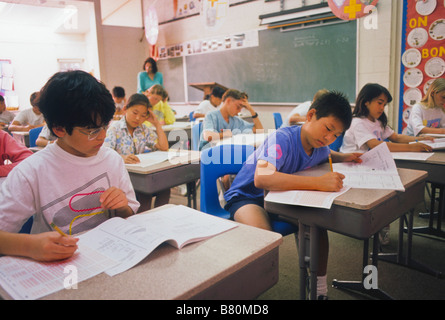 Junior high school students take progress test in class Stock Photo