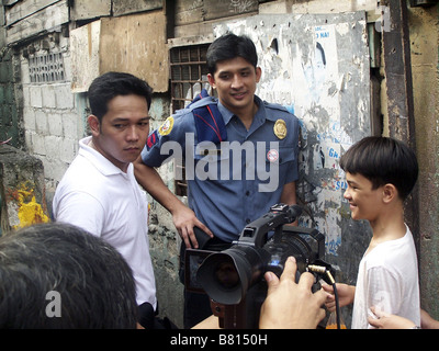 Ang Pagdadalaga ni Maximo Oliveros  The Blossoming of Maximo Oliveros Year: 2005 - Philippines Nathan Lopez et JR Valentin on the set du film  Director: Auraeus Solito Stock Photo