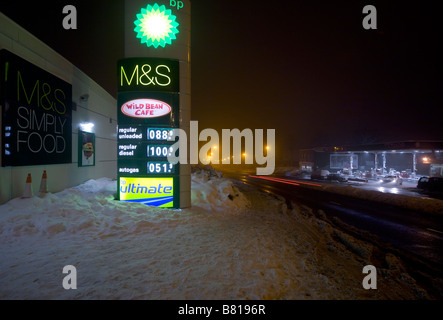 M+S themed petrol station next to Surrey A road in snow winter 2009 Stock Photo