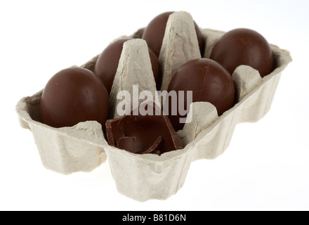 carton of small unwrapped chocolate easter eggs with one broken Stock Photo