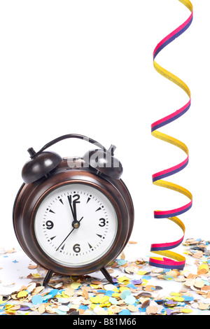 Waiting the New Year with clock confetti and ribbons Shallow depth of field Stock Photo