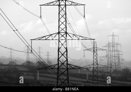 Power lines from Kilroot Power station cross country near Gleno, County Antrim, Northern Ireland. Stock Photo