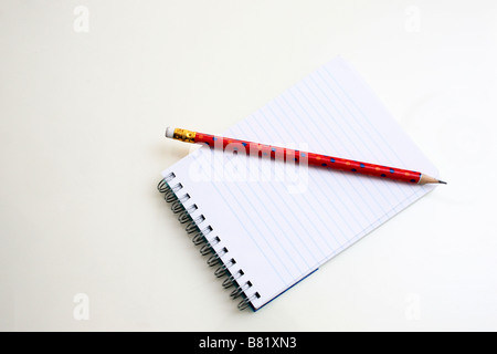 Notepad and pencil on white background Stock Photo