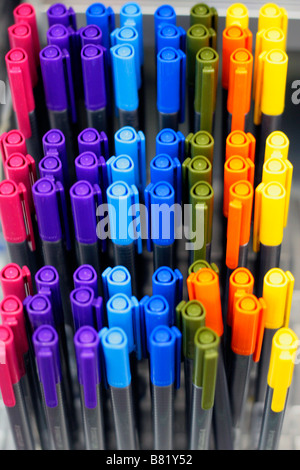 Artists Pens on display ready for sale. Yellow blue pink light blue green and orange. Stock Photo