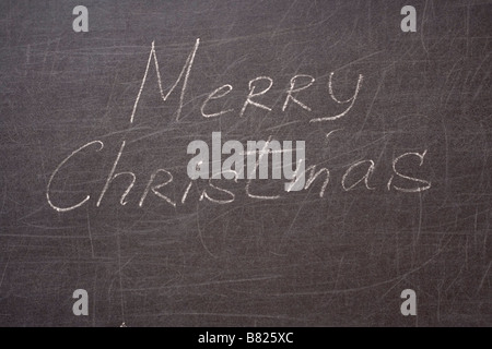 Merry christmas written on the school desk Stock Photo