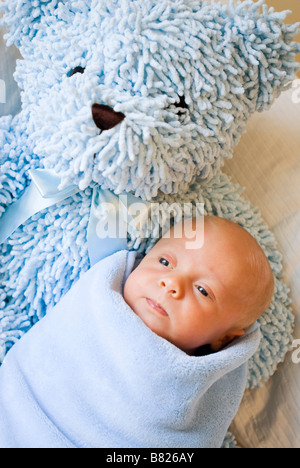 baby in baby blanket resting Stock Photo