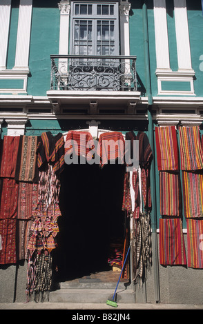 Colonial architecture and textile shop in handicraft market, Calle Linares, La Paz, Bolivia Stock Photo