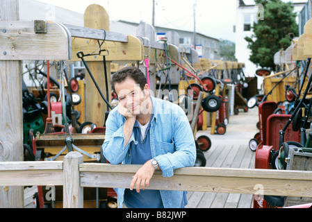 Portrait of a man leaning on railing Stock Photo