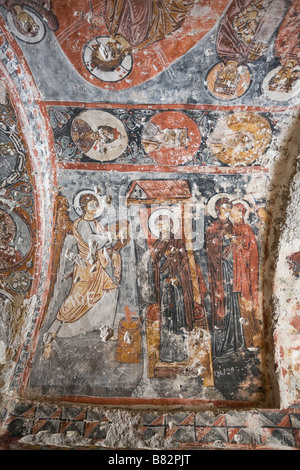 Fresco Decoration Two. Vibrant oranges and blues highlight the scenes in the ceilings of the Tahtali Killse or Barbara Church Stock Photo