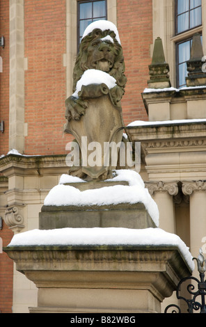 Lion statue outside Land Registry in Lincoln Inn Fields, London with snow on top Stock Photo