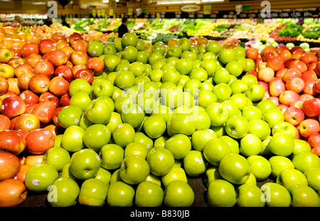 Three kinds of apples are on display in a supermarket produce section Stock Photo