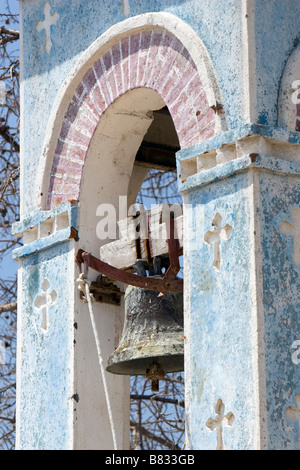 Close-up view of belfry tower old rusted bell of Agios Nicolas (Alasa) Church near Kouris Dam. South Cyprus Stock Photo