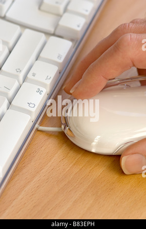 Man using mouse and computer keyboard close up Stock Photo