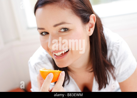 Happy American Teen Girl Holding Supplies For Painting In Hands In