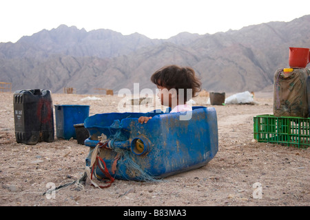 Bedouin girl cries for a pull in sledge in Ras Abu Gallum on the Red Sea coast, north of the Sinai resort of Dahab in Egypt Stock Photo