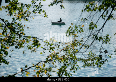 Two professional fishing rods on lake Bled, Slovenia. Fishermen waiting for  fish on the coast of lake Bled on a sunny day Stock Photo - Alamy