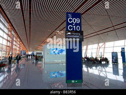 Modern architecture at departure gates inside new Beijing Airport Terminal 3 China 2009 Stock Photo