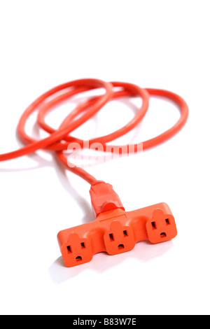 A 100 foot orange extension cord coiled up with a three way splitter Stock Photo