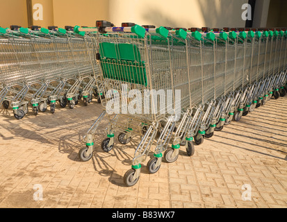 Rows of shopping trolleys outside supermarket Stock Photo