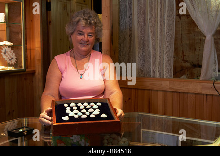 Valerie Clee showing opals at Underground Motel, Coober Pedy. Stock Photo