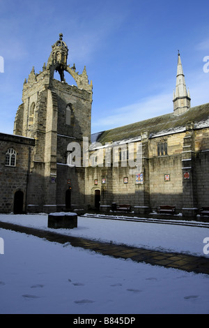 Kings College at the University in Old Aberdeen, with the chapel, tower and quad visible, covered in snow during winter Stock Photo
