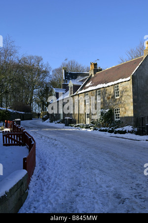 Houses at the Bridge of Balgownie in Old Aberdeen in Aberdeen, Scotland, UK, seen covered in snow and ice during winter Stock Photo
