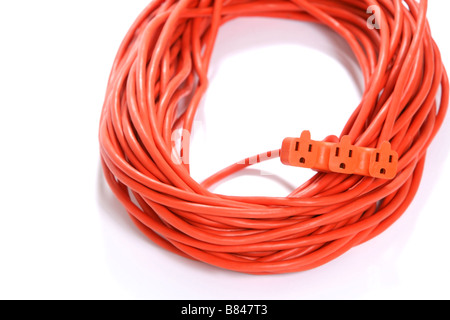 A 100 foot orange extension cord coiled up with a three way splitter Stock Photo