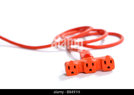 A 100 foot orange extension cord coiled up with a three way splitter Stock Photo