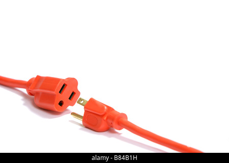 A 100 foot orange extension cord coiled up with a three way splitter Stock Photo