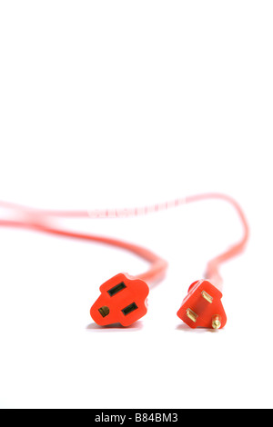 A 100 foot orange extension cord coiled up with a three way splitter Stock Photo