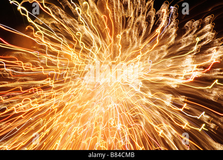 Detail of golden fireworks burst in night sky Stock Photo
