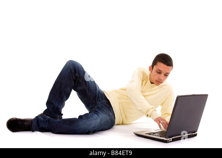 young men working with his laptop on the floor Stock Photo