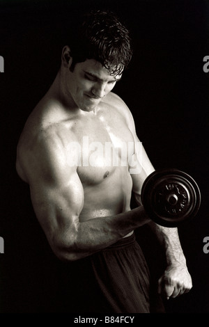 Man working out with hand weights Stock Photo