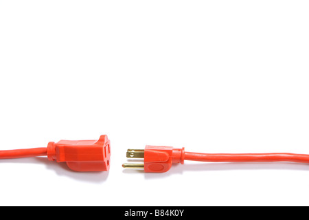 A 100 foot orange extension cord coiled up with a three way splitter Stock Photo