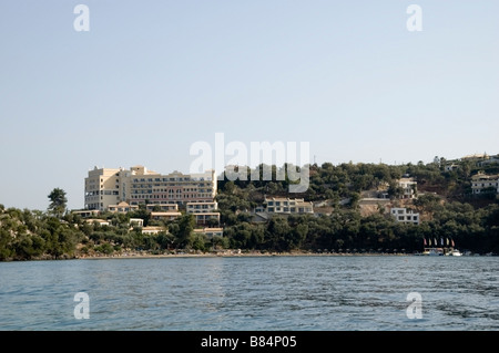 See side costal view of Eva Palace Hotel, holiday resort, Greco, Kouloura, Kalami region of Corfu, Kerkyra, Greece, Europe, EU Stock Photo