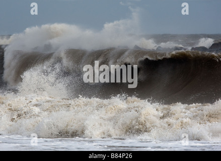 High tides - breaking waves on the North Norfolk coastline Stock Photo
