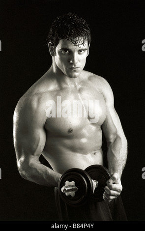Man working out with hand weights. Stock Photo