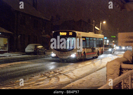 Bus in a snow blizzard Stock Photo