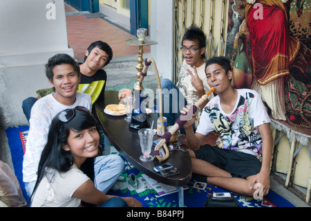 Teenager Arab Quarter Singapore Kampong Glam Smoking water pipe Stock Photo