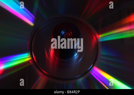 stack of CD's on a spindle lit with red and blue studio lighting Stock Photo