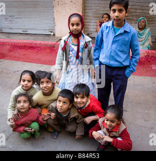 Group of local children pose on street Bikaner Rajasthan India Stock Photo