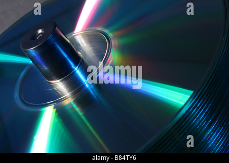 stack of CD's on a spindle lit with red and blue studio lighting Stock Photo